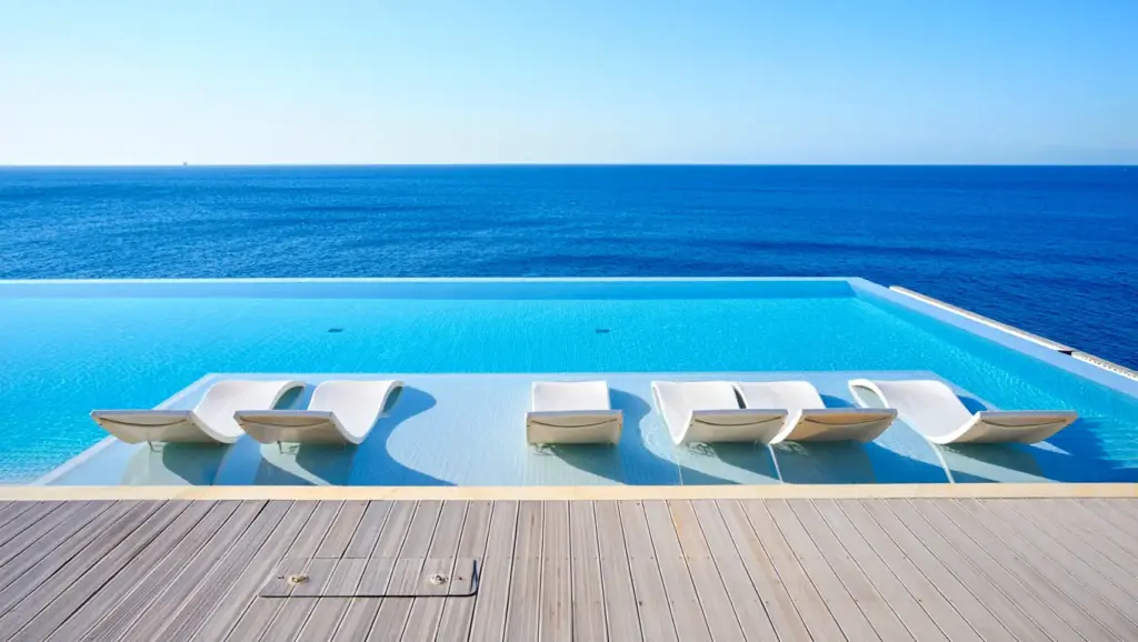 An infinity pool overlooking the ocean at a luxury resort
