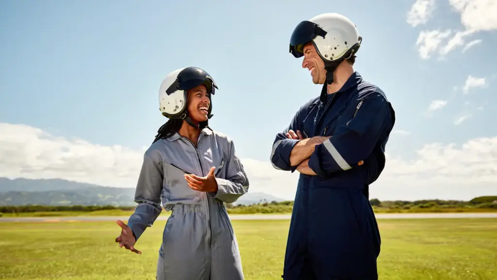 An instructor and a student sharing a happy moment after a successful flight.