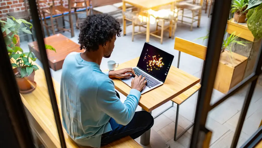 A person using a laptop to plan a trip